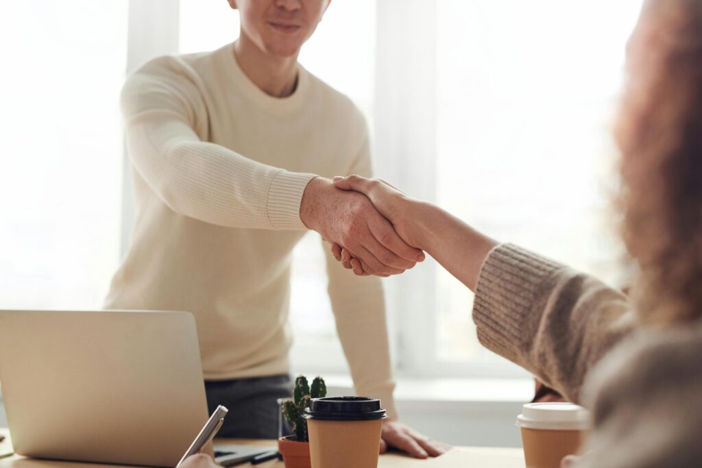 Two people shaking hands.